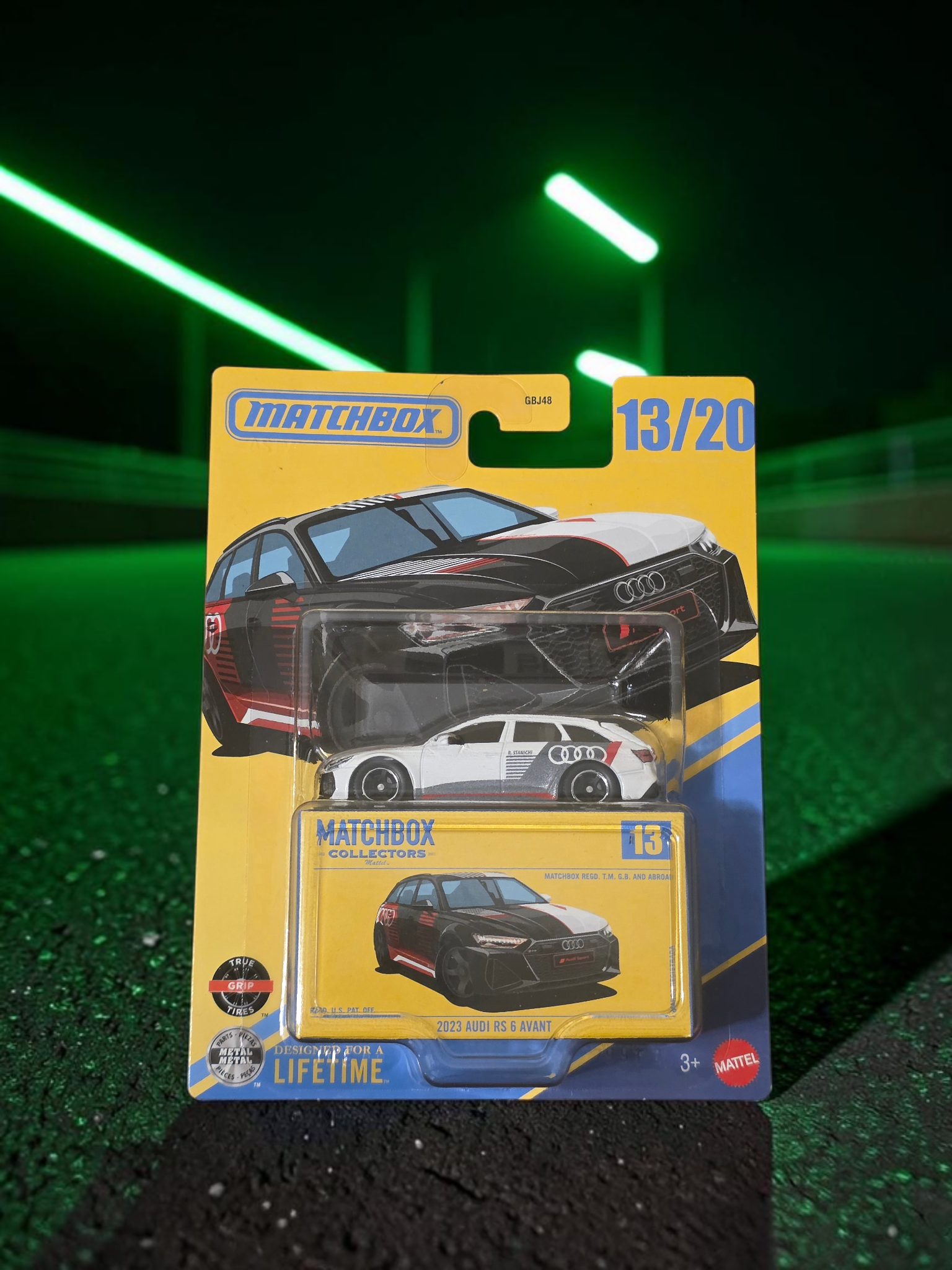 Winters & Johnson Diecast Matchbox Collectors 2023 Audi RS 6 Avant in white and black packaging on a neon green road