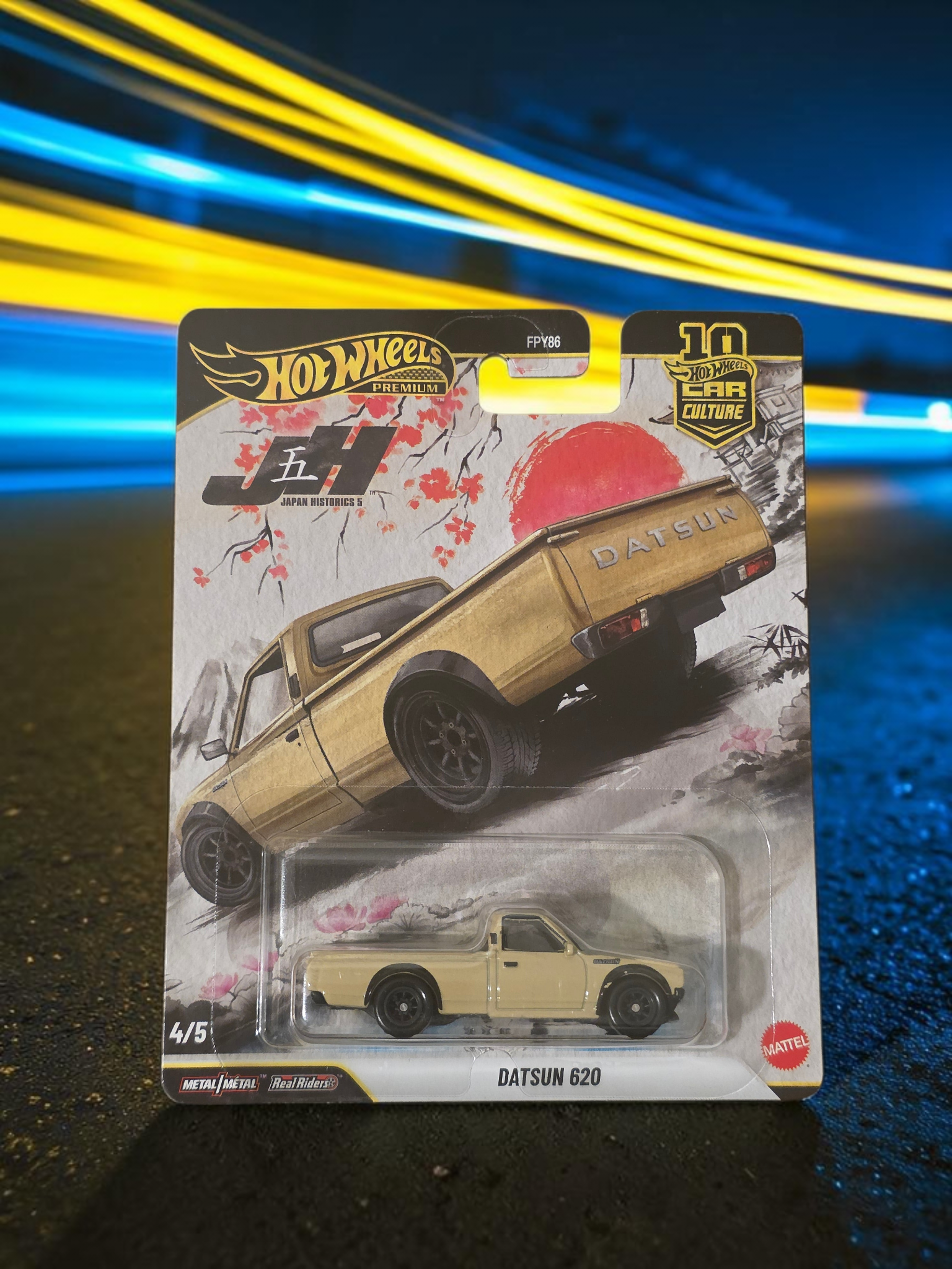Winters & Johnson Diecast Hot Wheels Premium Datsun 620 Japan Historics 3 diecast truck in blister packaging.